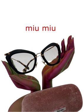 MIU MIU 
SMU10N 5524 Gold SMUO4Q Cat Eye Sunglasses